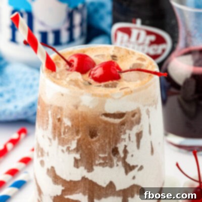 Close up of a glass os fluffy soda.