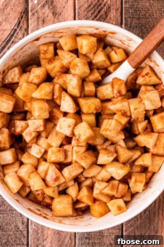 Warm Blueberry Apple Crisp 11 Chopped apples coated in sugar, cinnamon, and flour.