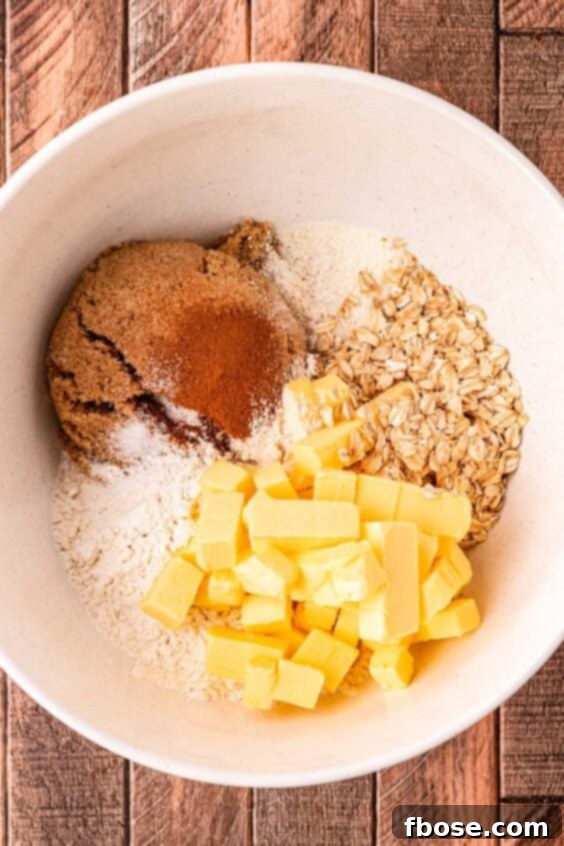 Warm Blueberry Apple Crisp 9 Ingredients to make crisp topping for apple crisp in a bowl ready to be mixed.