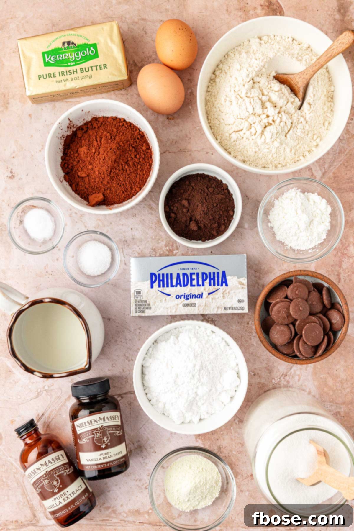 Overhead photo of ingredients to make chocolate cookies with cheesecake filling on a table.