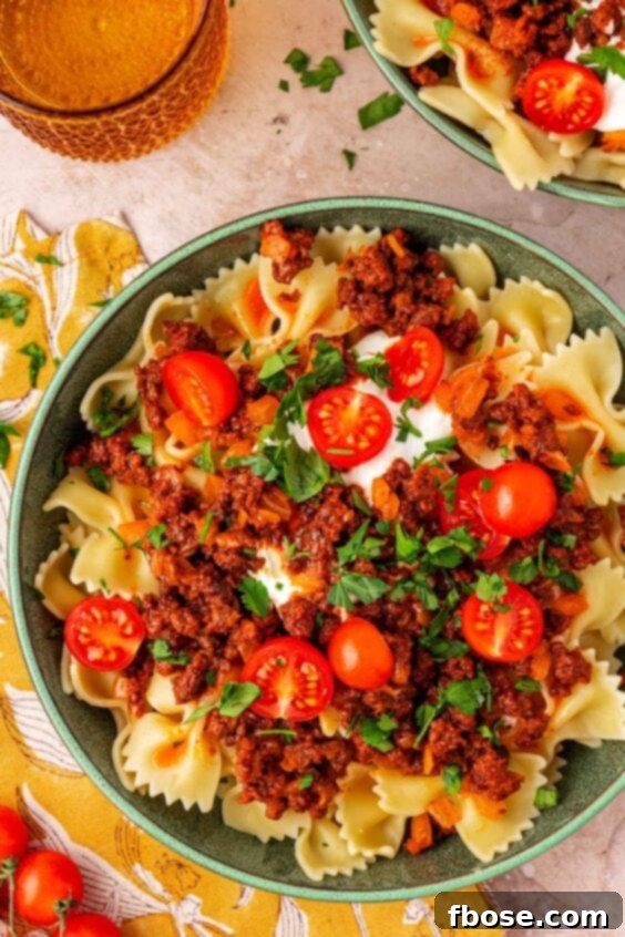 Overhead photo of Anna Paul's Turkish Pasta recipe in a teal bowl.