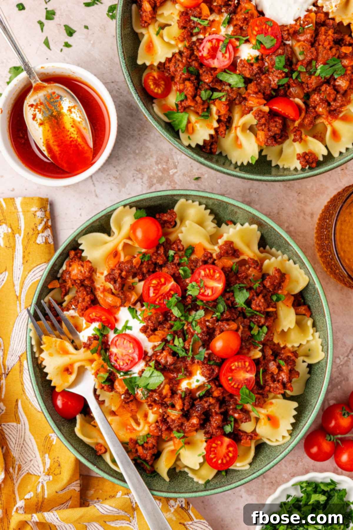 Overhead photo of TikTok Turkish Pasta served in multiple bowls on a table, ready for a group.