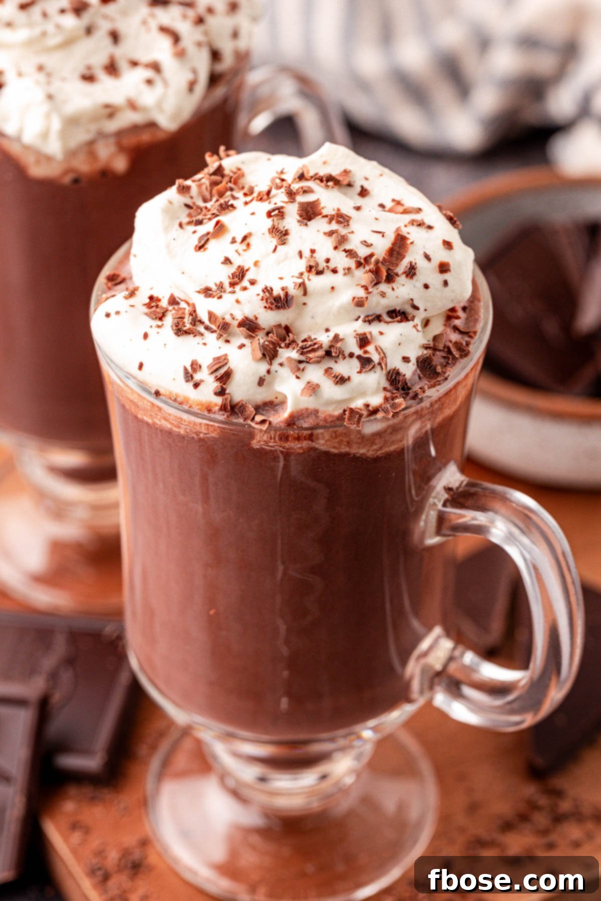 Close-up of a mug of Tini's Hot Chocolate, showcasing the rich texture and a hint of steam rising from the top.