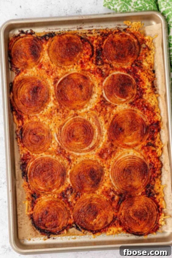 Onion Ring Chips on a sheet pan that just came out of the oven.