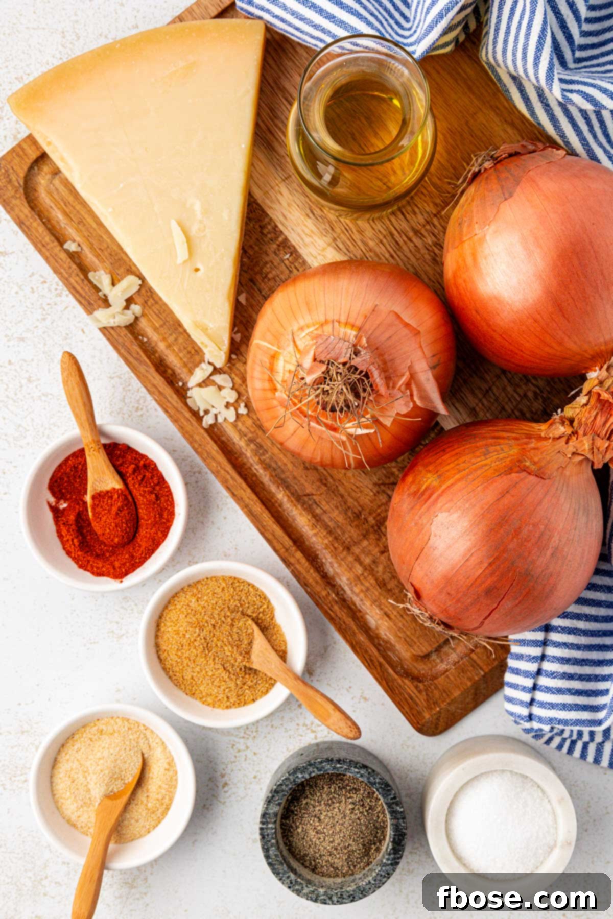 Overhead photo of ingredients laid out on a cutting board, ready to make TikTok viral onion ring chips.