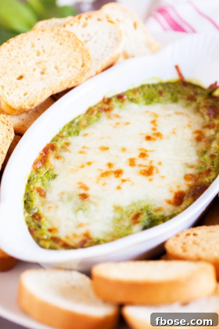 Rich and creamy baked spinach artichoke dip, perfect for parties.