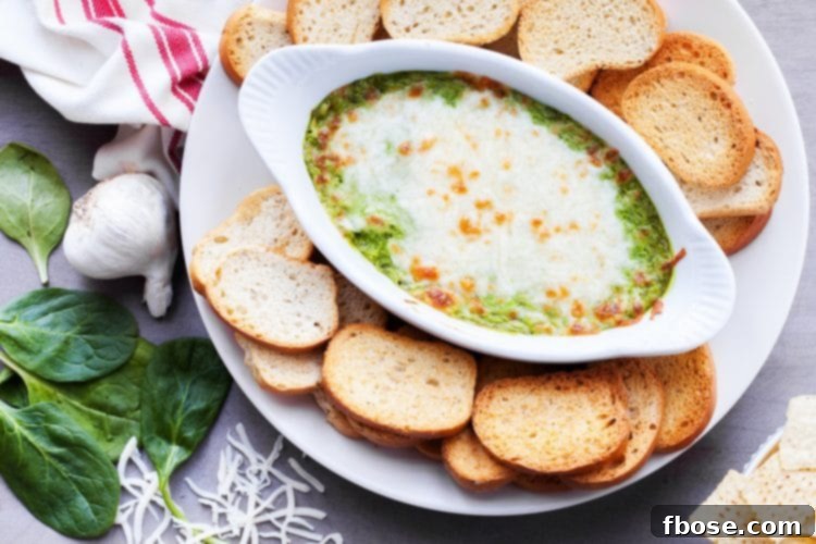 Classic baked spinach and artichoke dip, warm and bubbly.