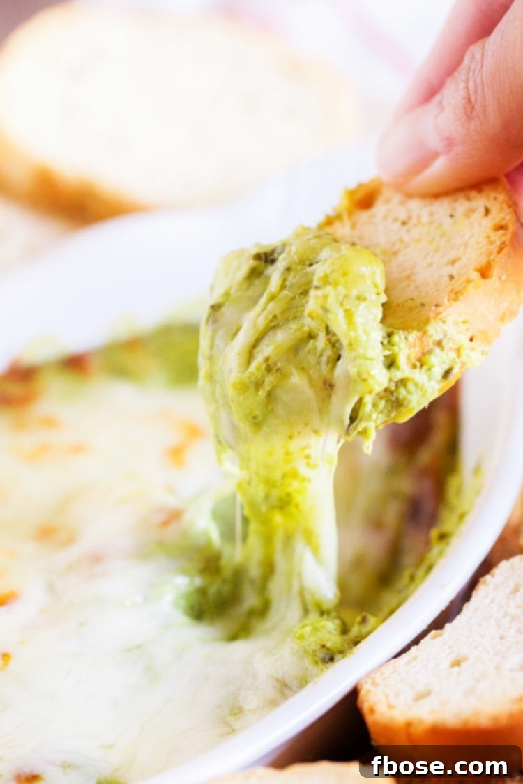 A close-up of the creamy and rich spinach artichoke dip recipe.