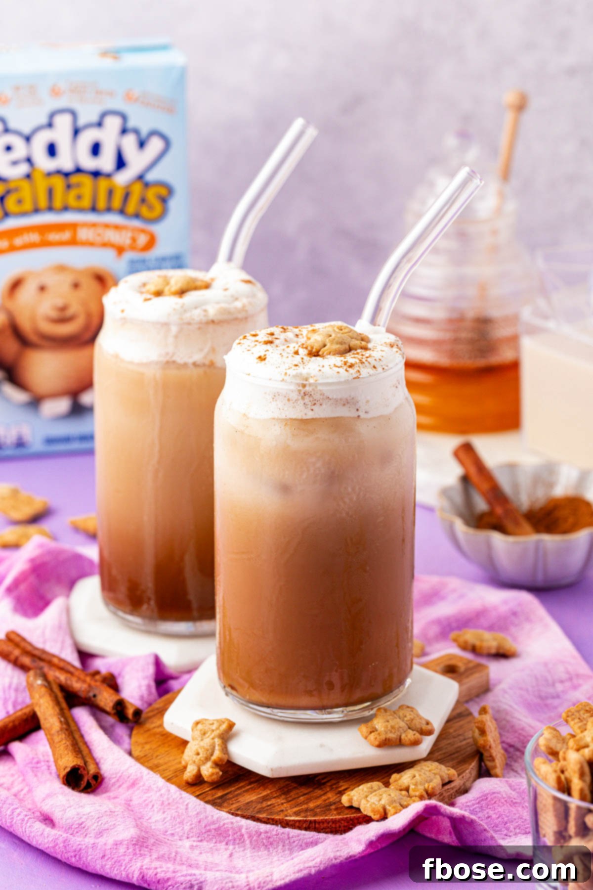 Graham Bear Bliss Latte 9 Two glasses of the viral Teddy Graham Lattes side-by-side, garnished with cinnamon and Teddy Grahams.