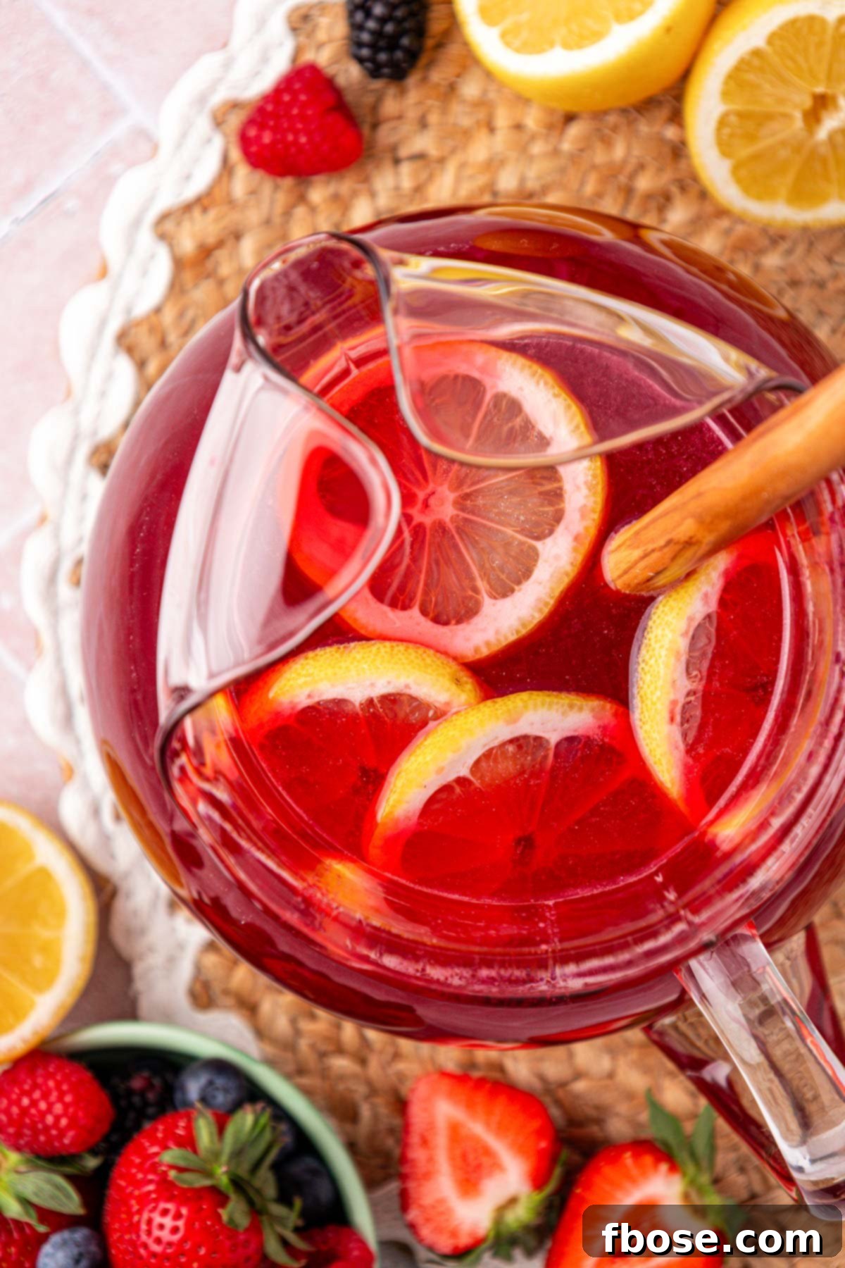 Overhead photo of a pitcher of berry lemonade.