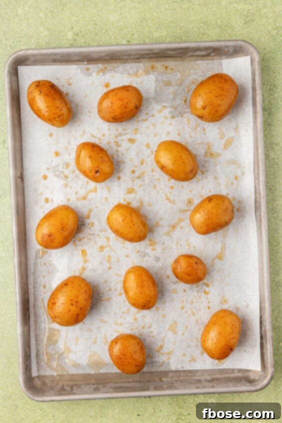 Baby yukon potatoes on a baking pan.