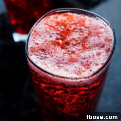 Blood and Guts cocktail with jello chunks and a blood-red grenadine swirl, ready to be enjoyed.