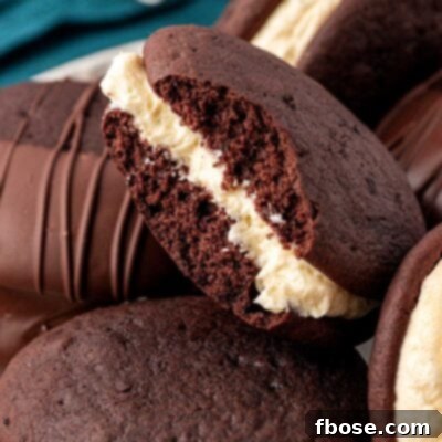 Whoopie pies on a a plate, one is missing a bite.