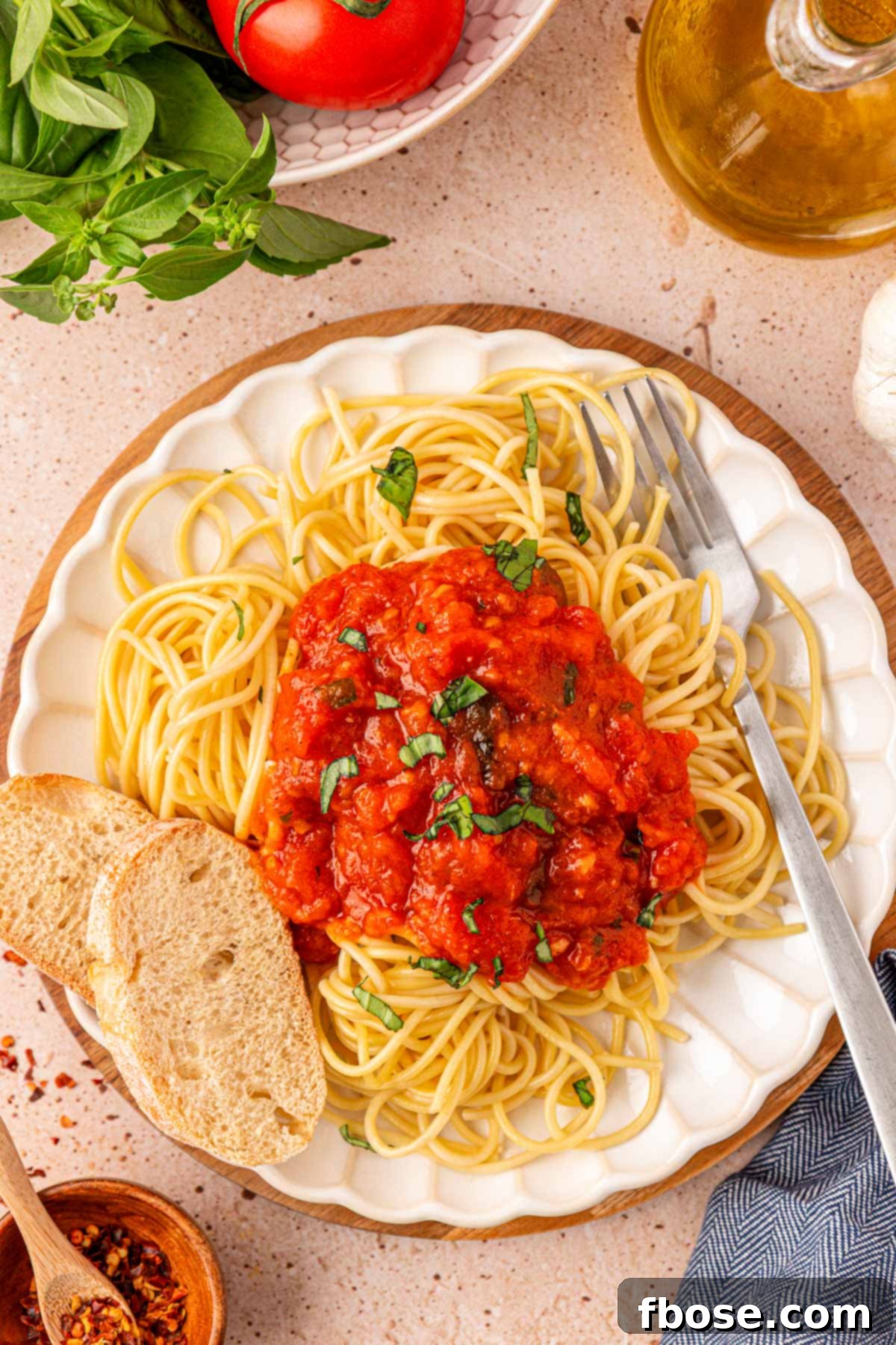 Sun-Kissed Tomato Simplicity 6 Overhead photo of a plate with spaghetti and marinara sauce.