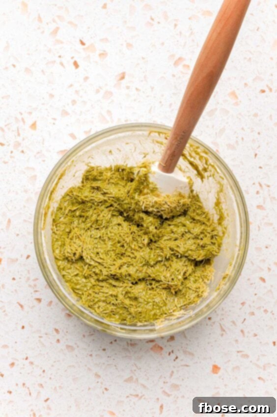 Kataifi and pistachio cream filling for Dubai bars in a bowl, showing the mixture ready to be placed in molds.