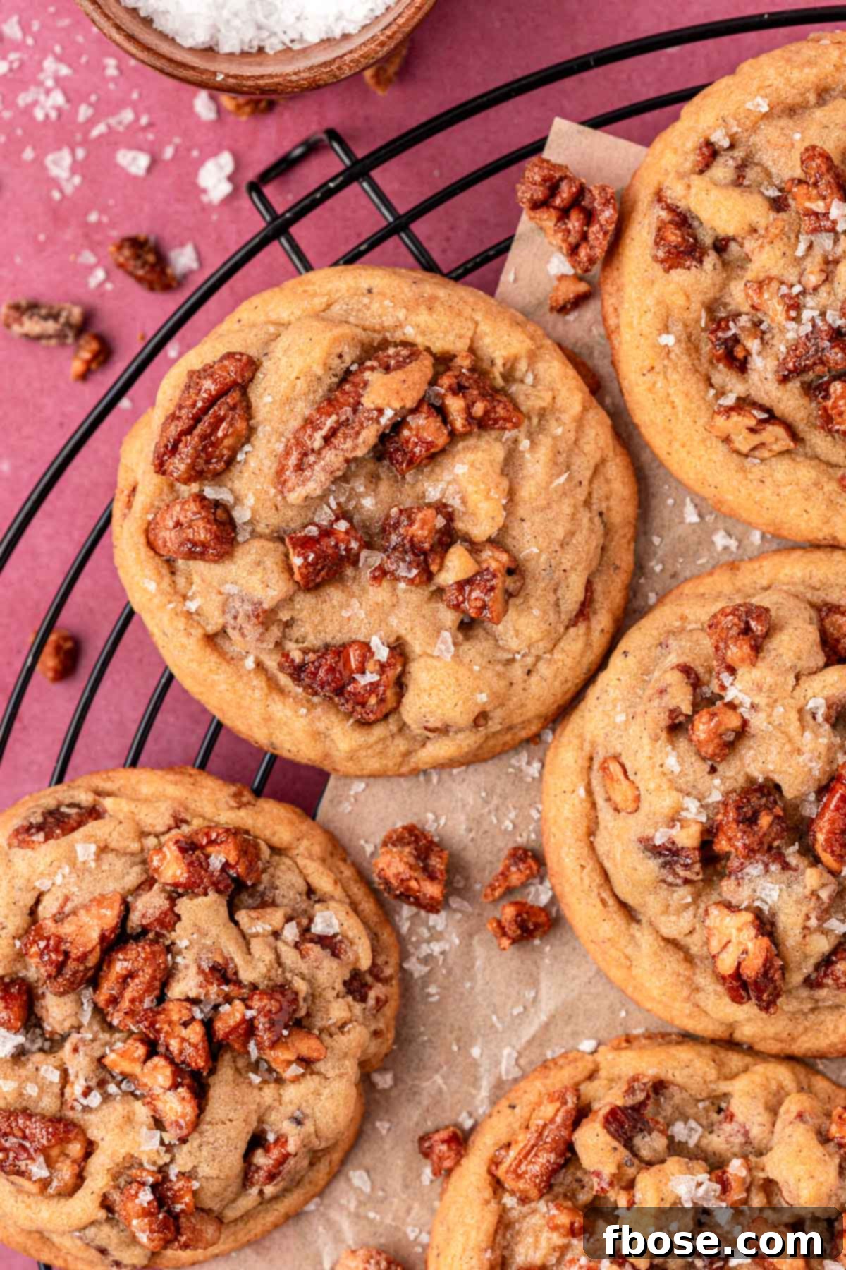 An inviting overhead photo of Brown Butter Maple Pecan Cookies cooling on a wire rack, ready to be enjoyed.
