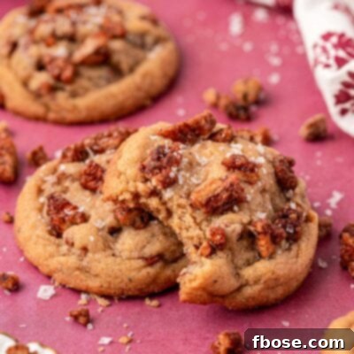 Maple Pecan Cookies on a table, one is missing a bite.