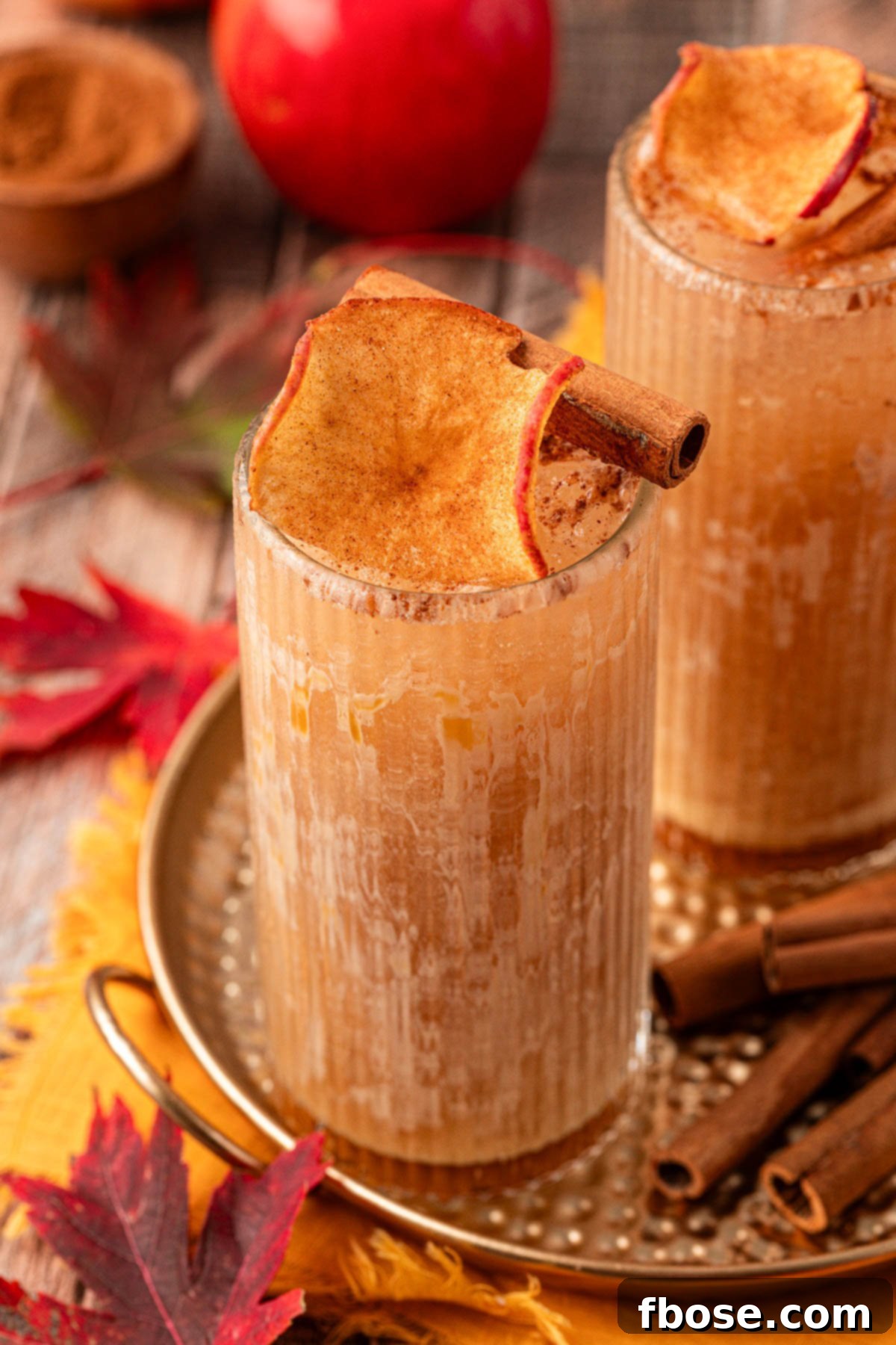 Autumn Crisp Quencher 7 An apple cider drink on a gold tin platter, ready for enjoyment.