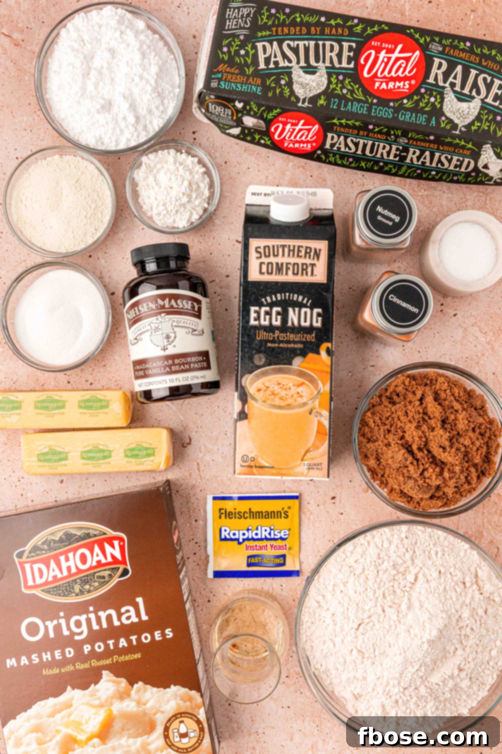 Eggnog Delight Swirls 4 All the fresh ingredients needed to make eggnog cinnamon rolls, beautifully arranged on a table.