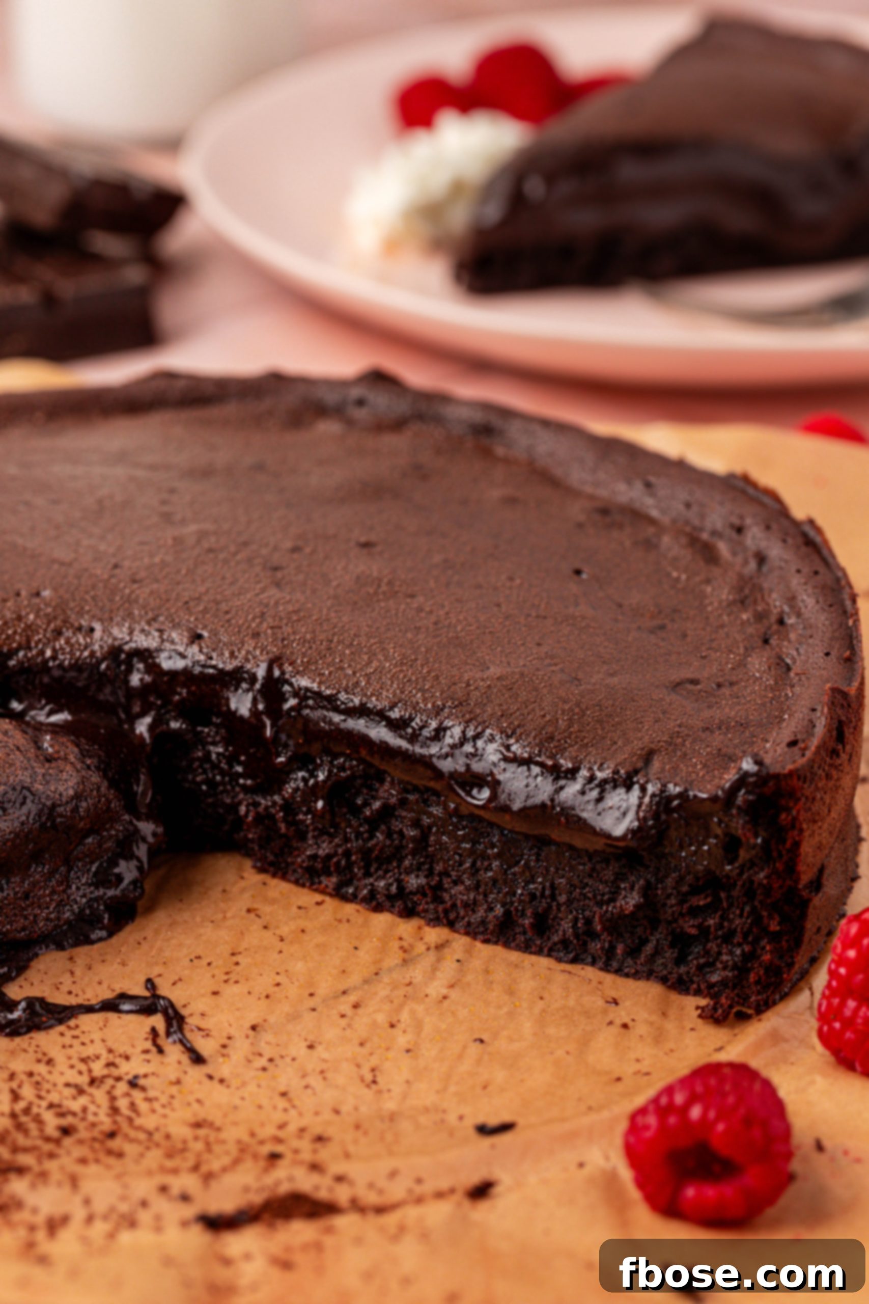 A close-up shot of a sliced Soft Chocolate cake, revealing its moist and inviting texture.