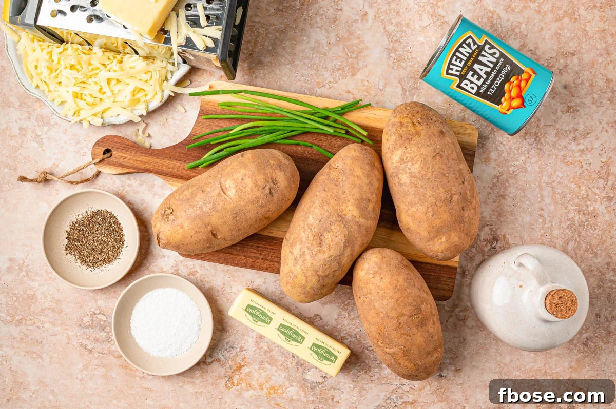 Ingredients to make beans and cheese loaded jacket potatoes on a table.