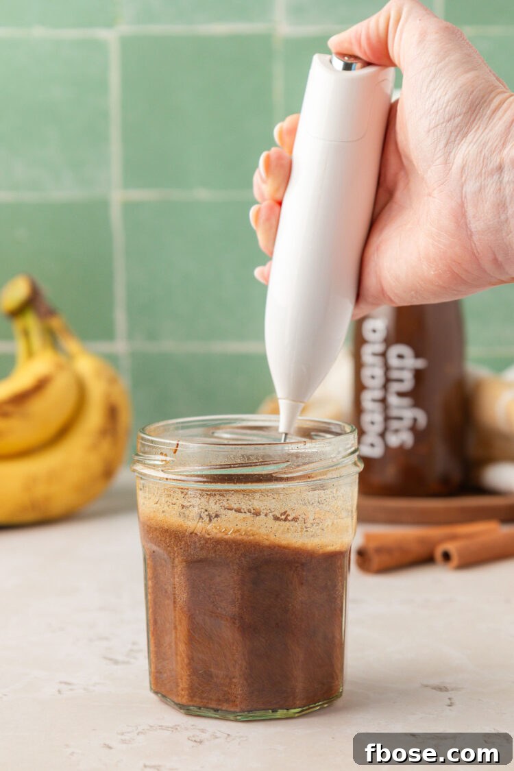Froth with a hand frother.