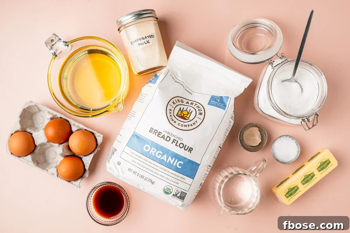 Ingredients to make Malasadas on a pink table.