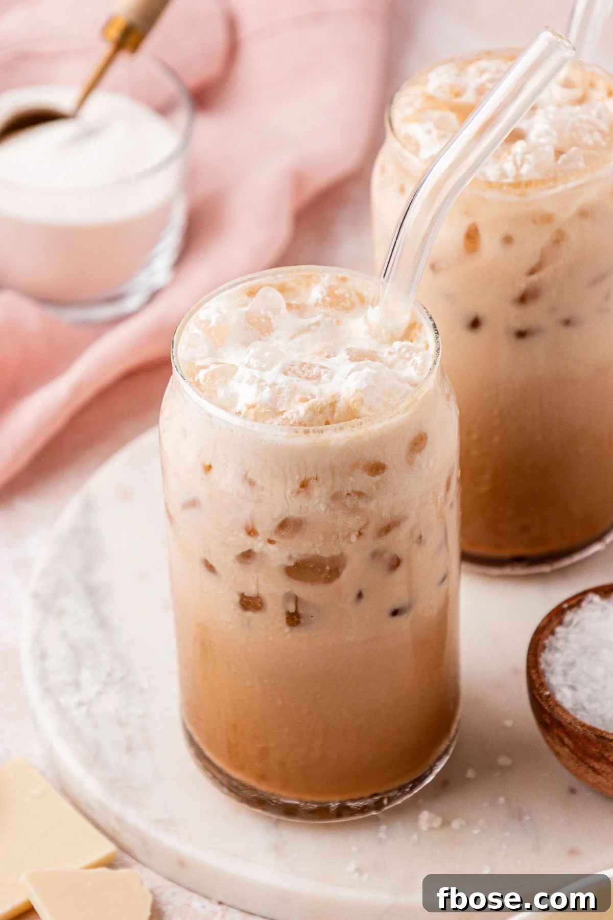 Close up of two glasses with Washington style americano coffees in them.