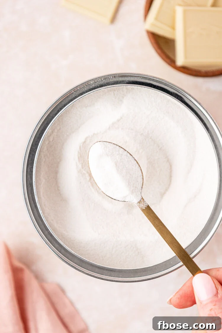 Add white chocolate and salt to a cup.